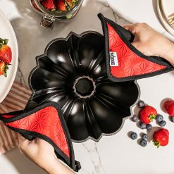Alternative view of Cast Iron Fluted Cake Pan with Red Potholders